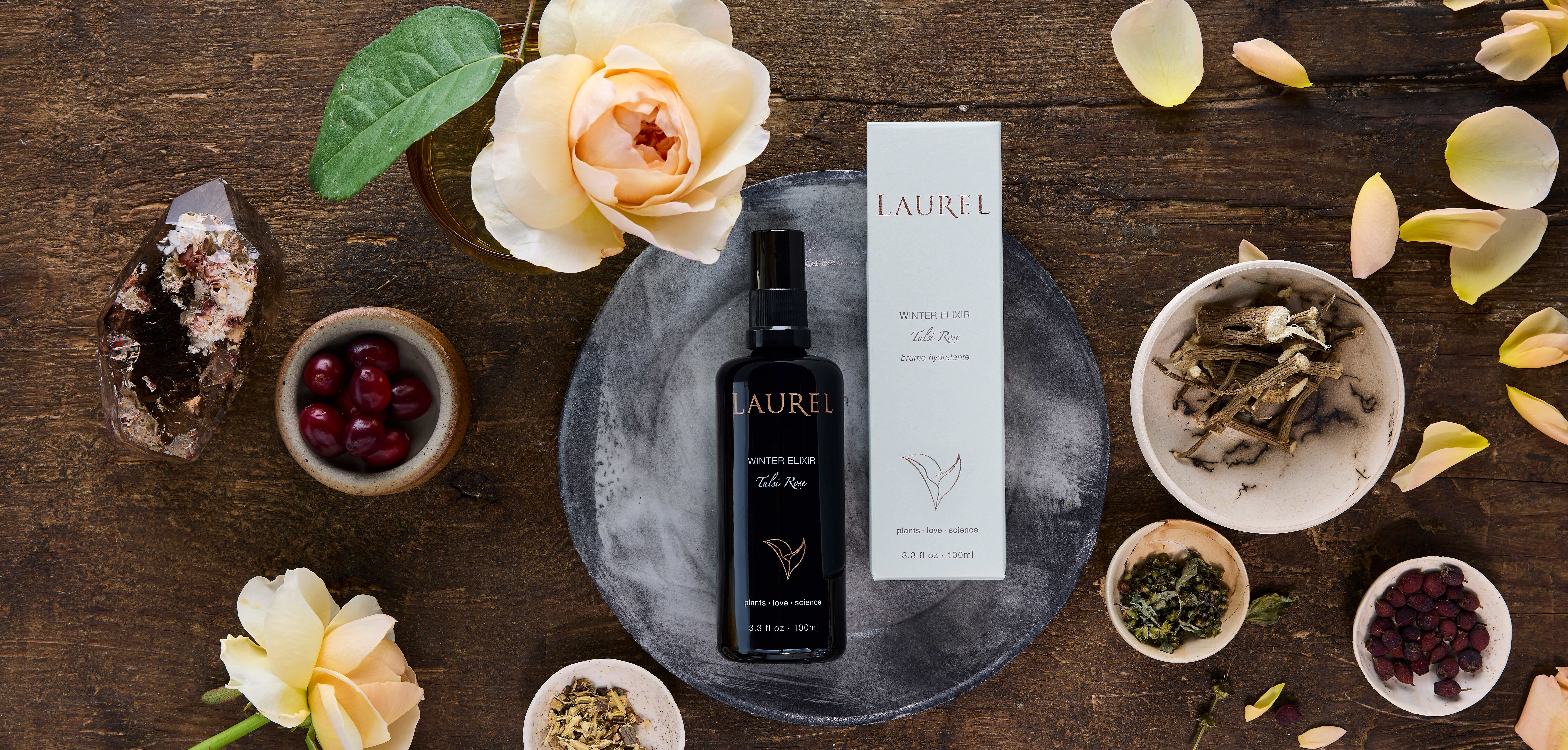 Winter Elixir bottle with roses, roots and berries