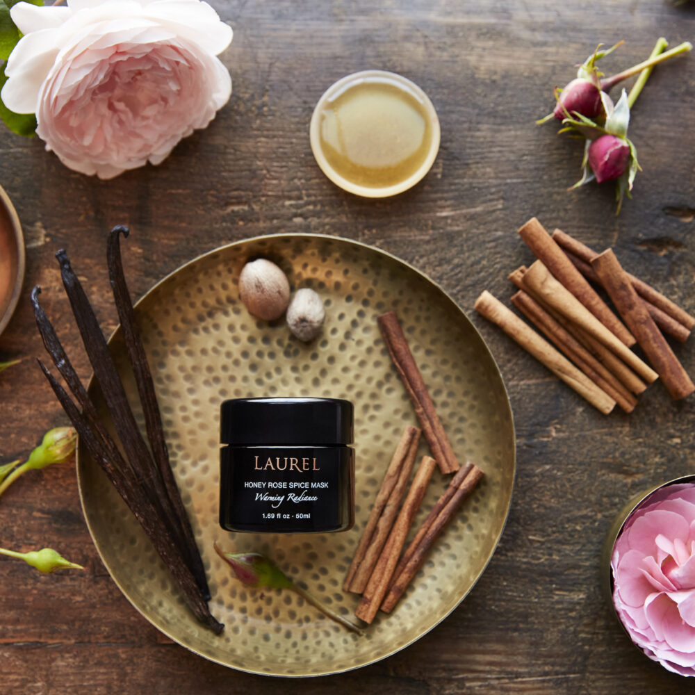 Honey Rose Spice Mask surrounded by warming spices and lush roses.