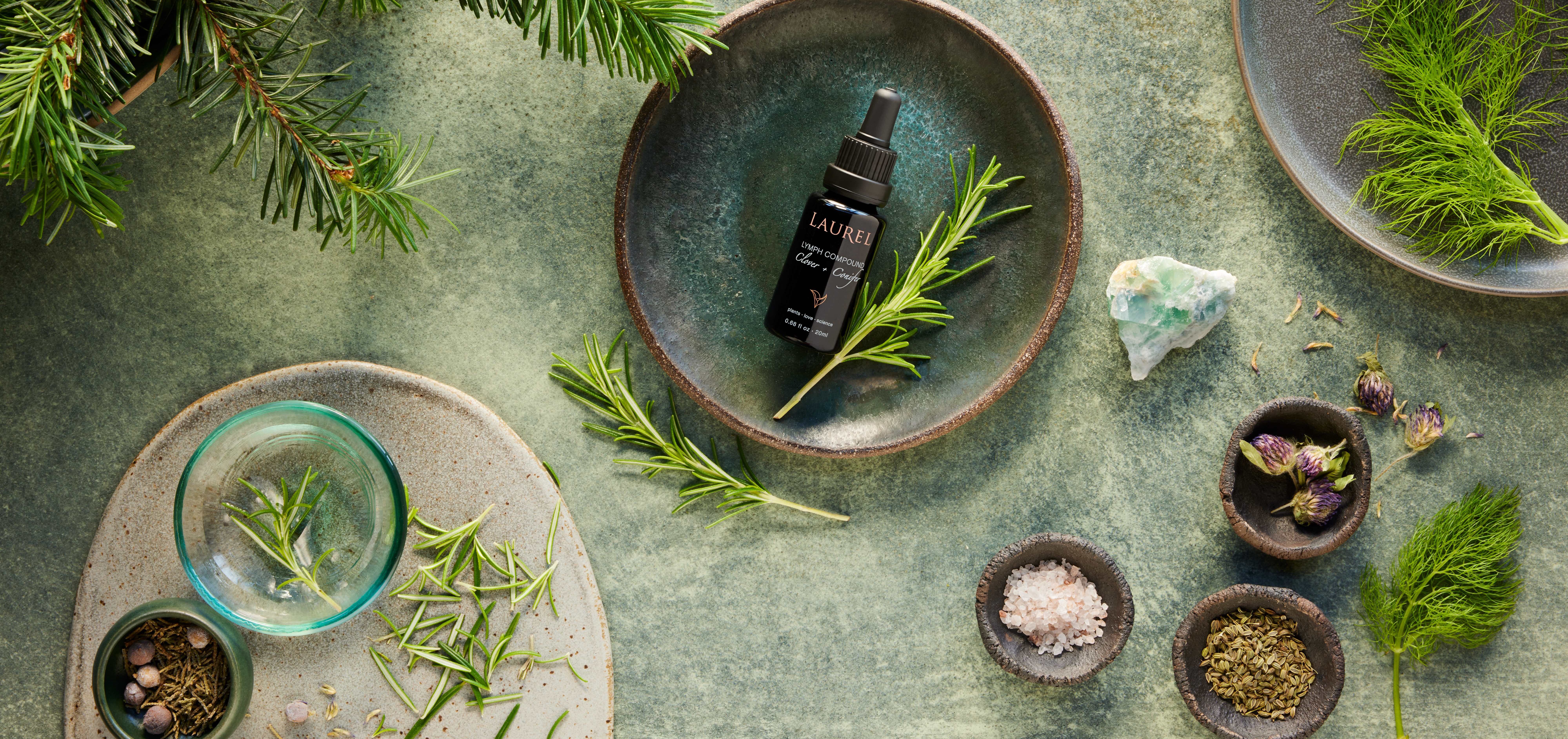 Lymph Compound surrounded by herbs and branches