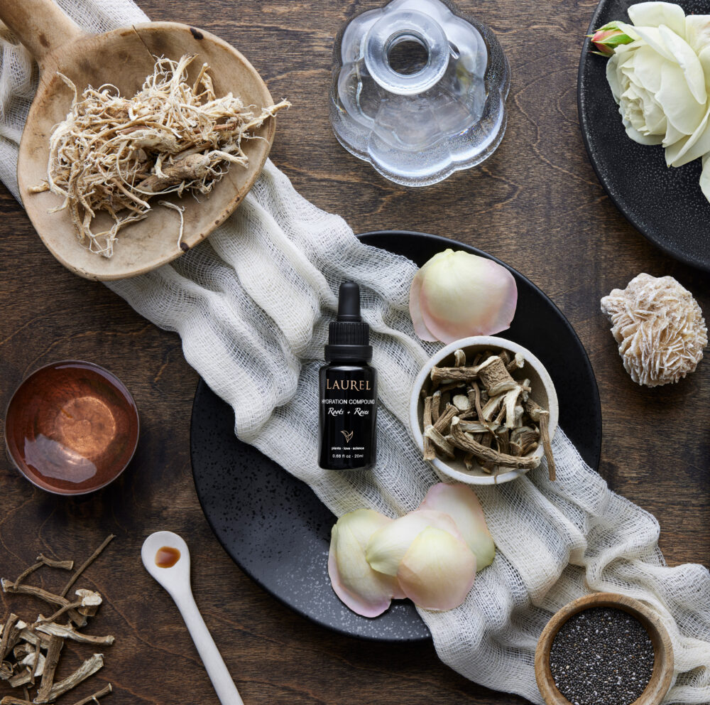 Hydration Compound surrounded by petals, roots and roses.